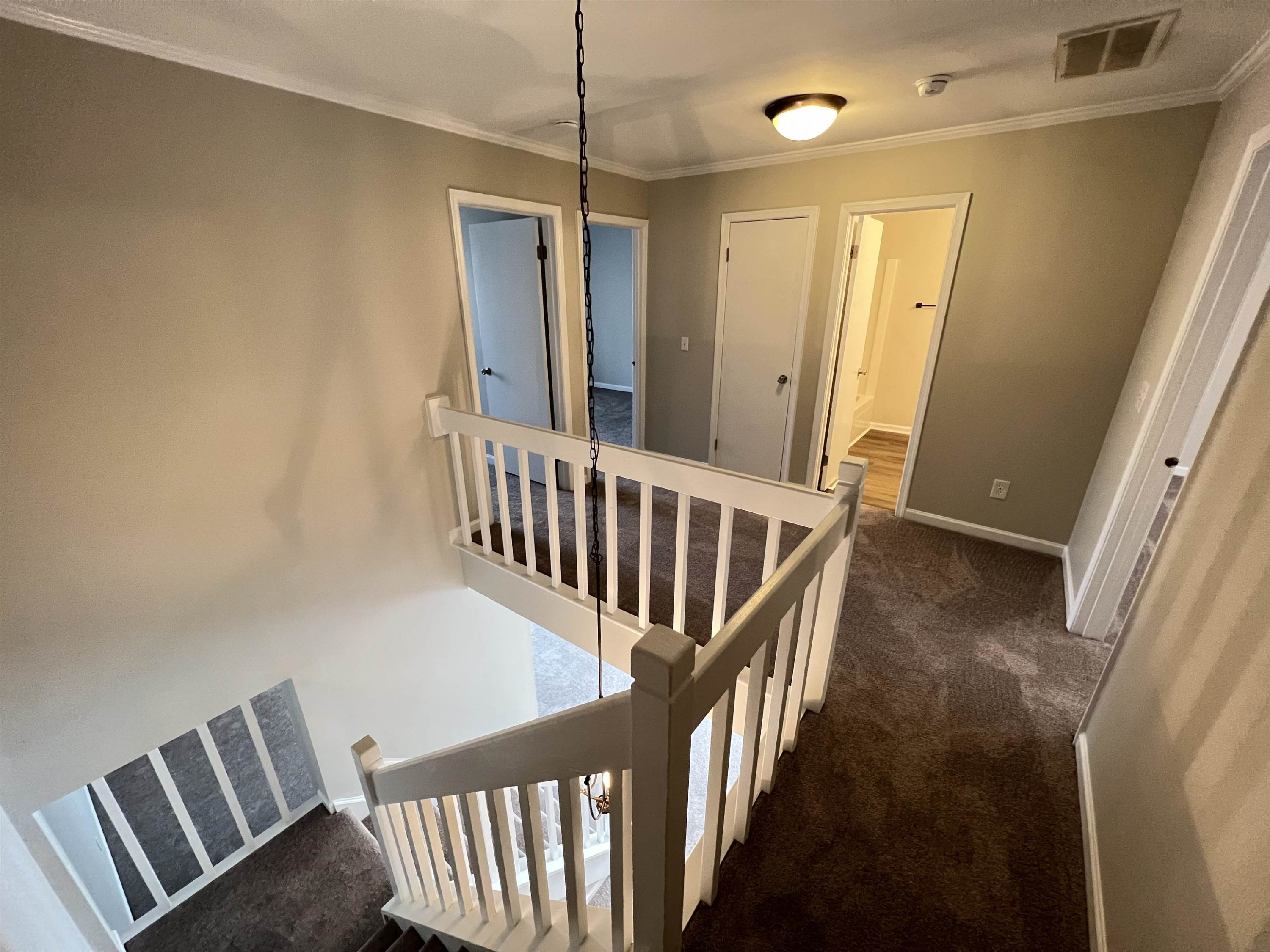 1227 Seaton Road, Unit 33 Durham, NC 27713 - Photo 12 of 21 a view of a hallway with wooden floor and staircase