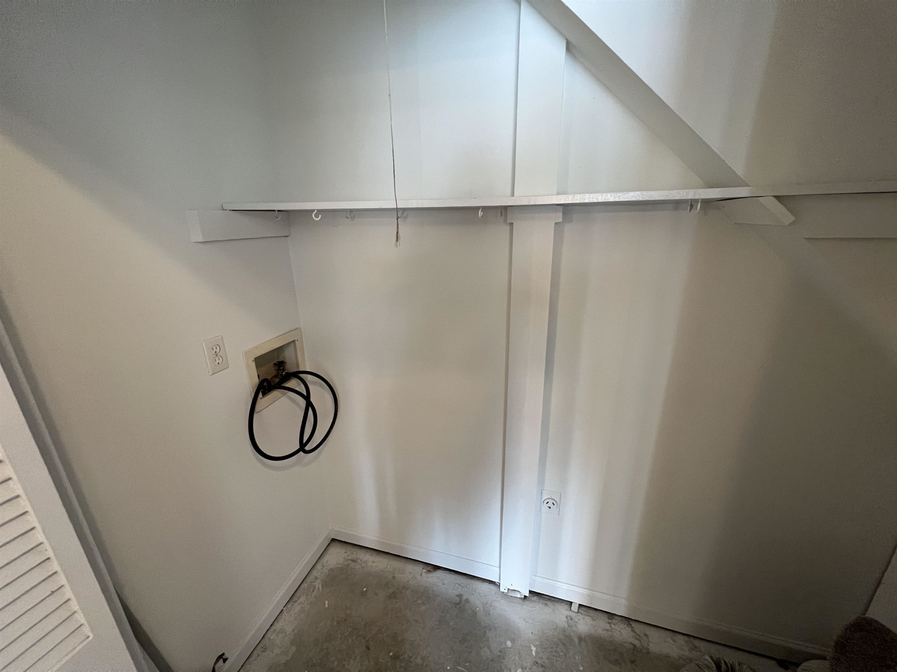 1227 Seaton Road, Unit 33 Durham, NC 27713 - Photo 16 of 21 a view of a room with rack on the wall and a window