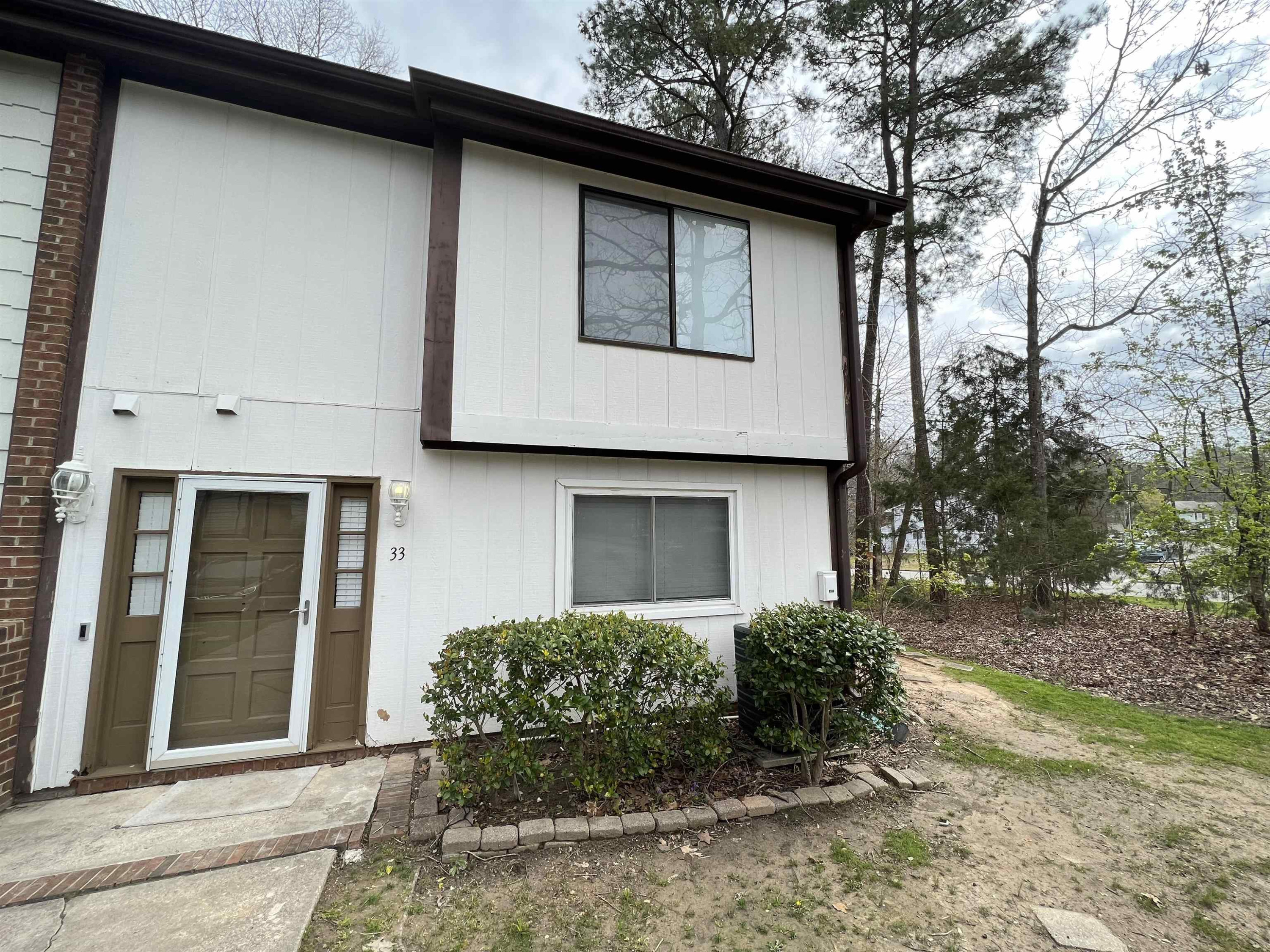 1227 Seaton Road, Unit 33 Durham, NC 27713 - Photo 4 of 21 a house that has a lot of windows in it