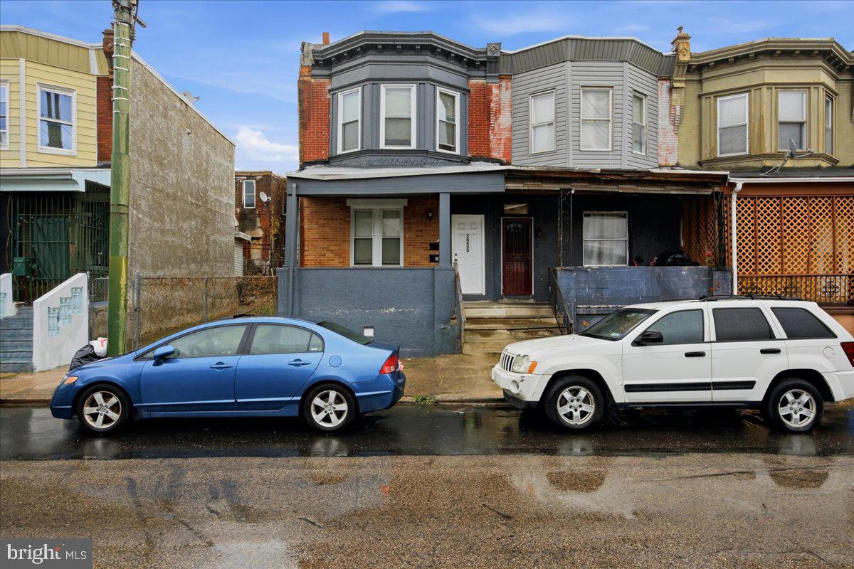 a car parked in front of a house
