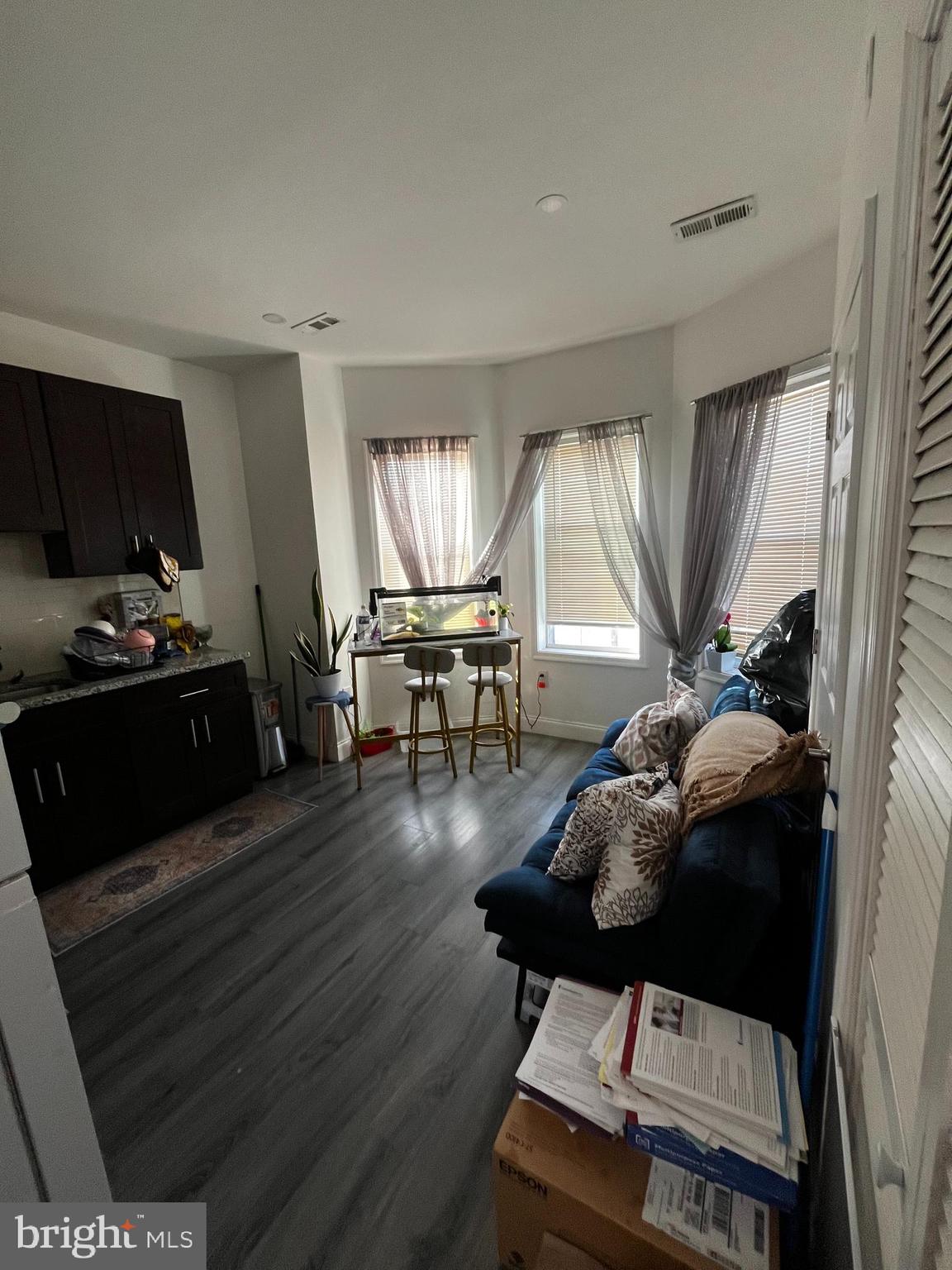 3935 North 10th Street Philadelphia, PA 19140 - Photo 11 of 12 a living room with furniture and a flat screen tv