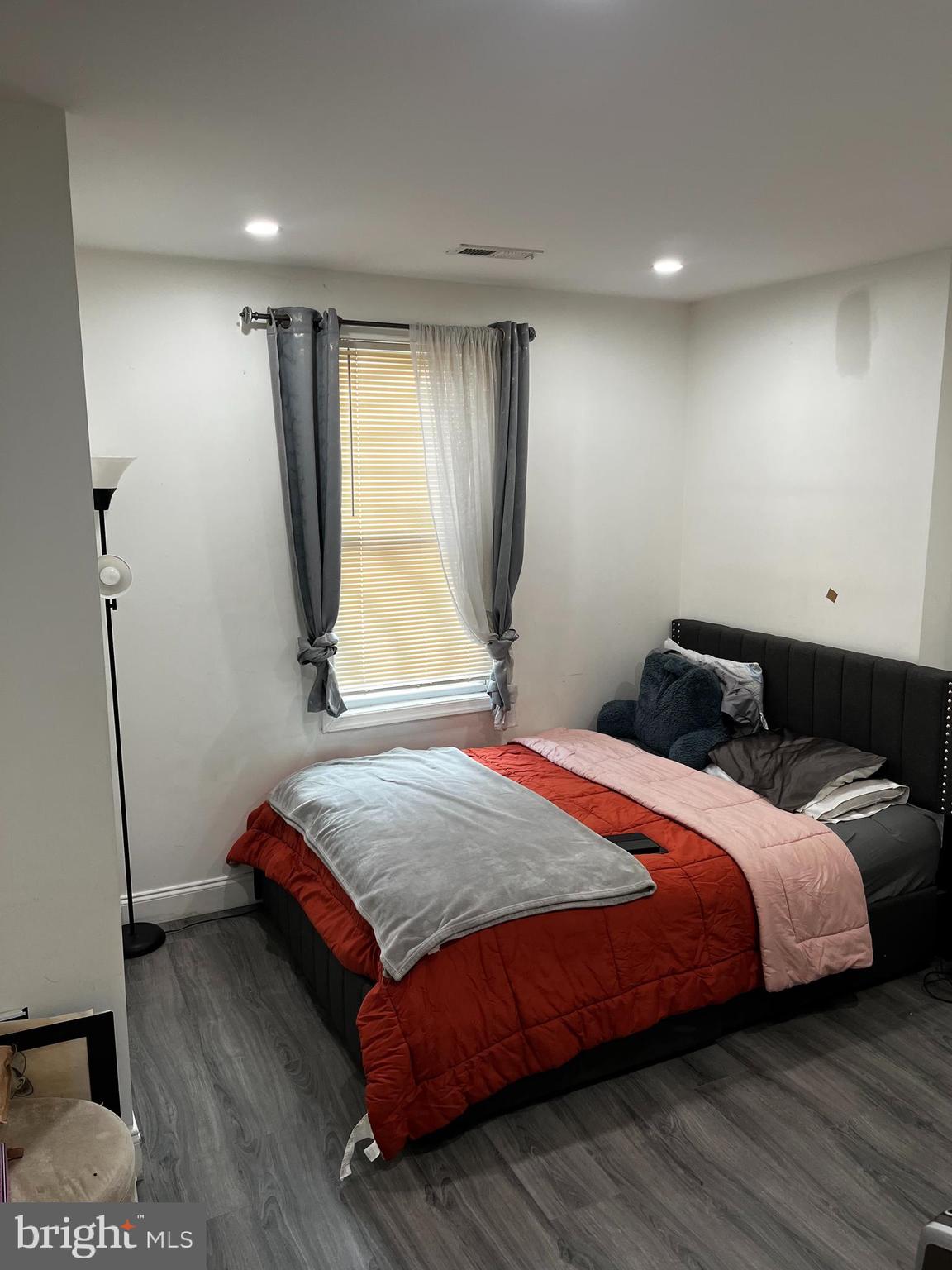 3935 North 10th Street Philadelphia, PA 19140 - Photo 12 of 12 a bedroom with a bed and a window