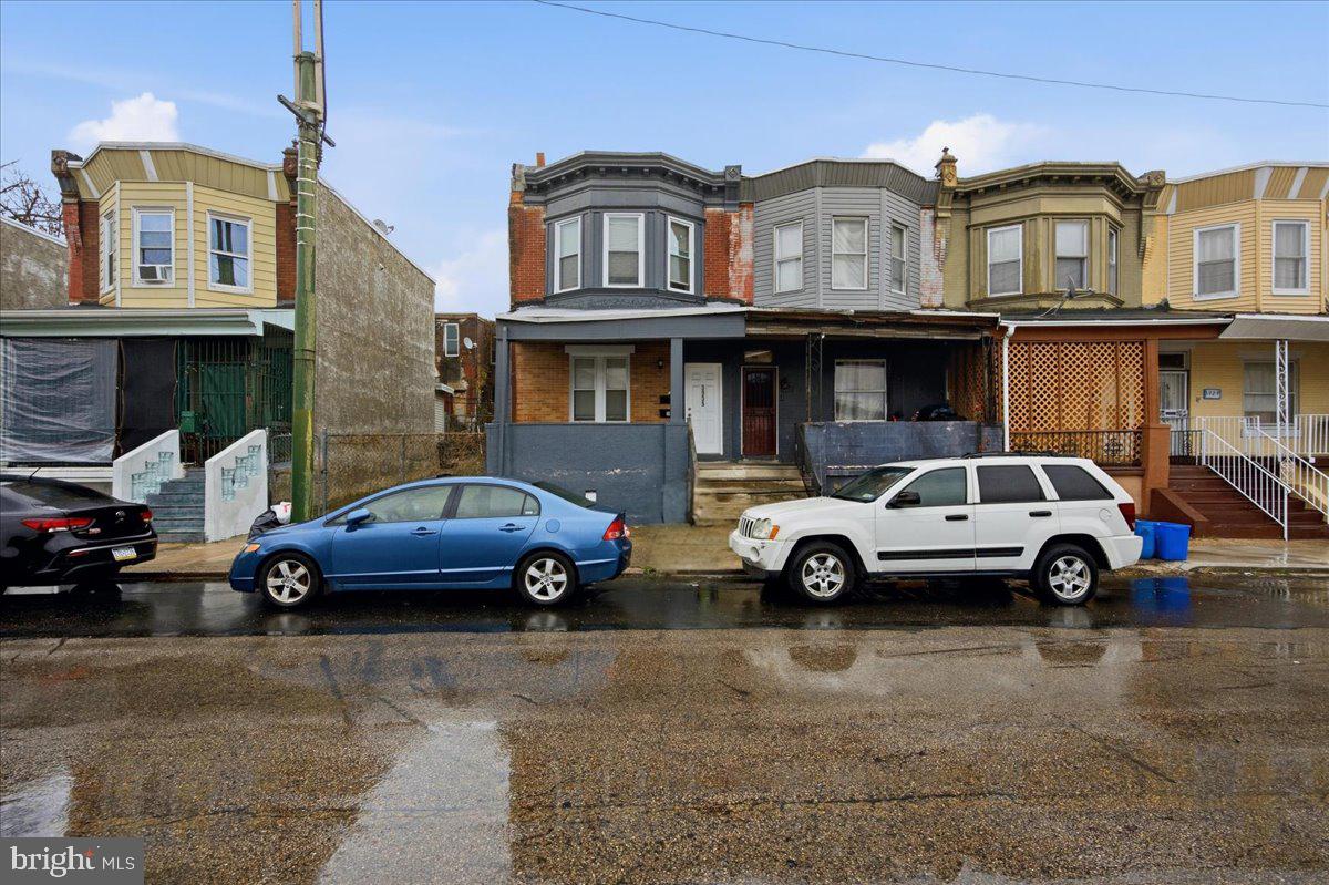 3935 North 10th Street Philadelphia, PA 19140 - Photo 6 of 12 a car parked in front of a big house