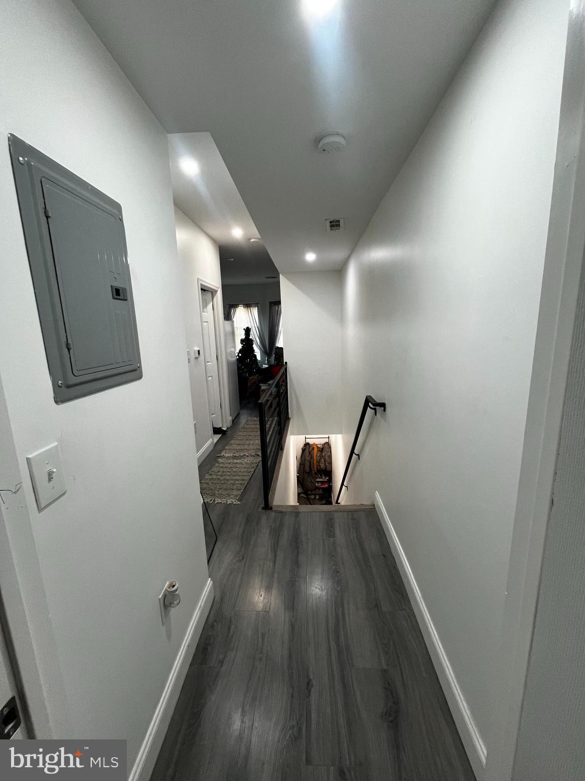 3935 North 10th Street Philadelphia, PA 19140 - Photo 9 of 12 a view of a hallway with wooden floor and staircase