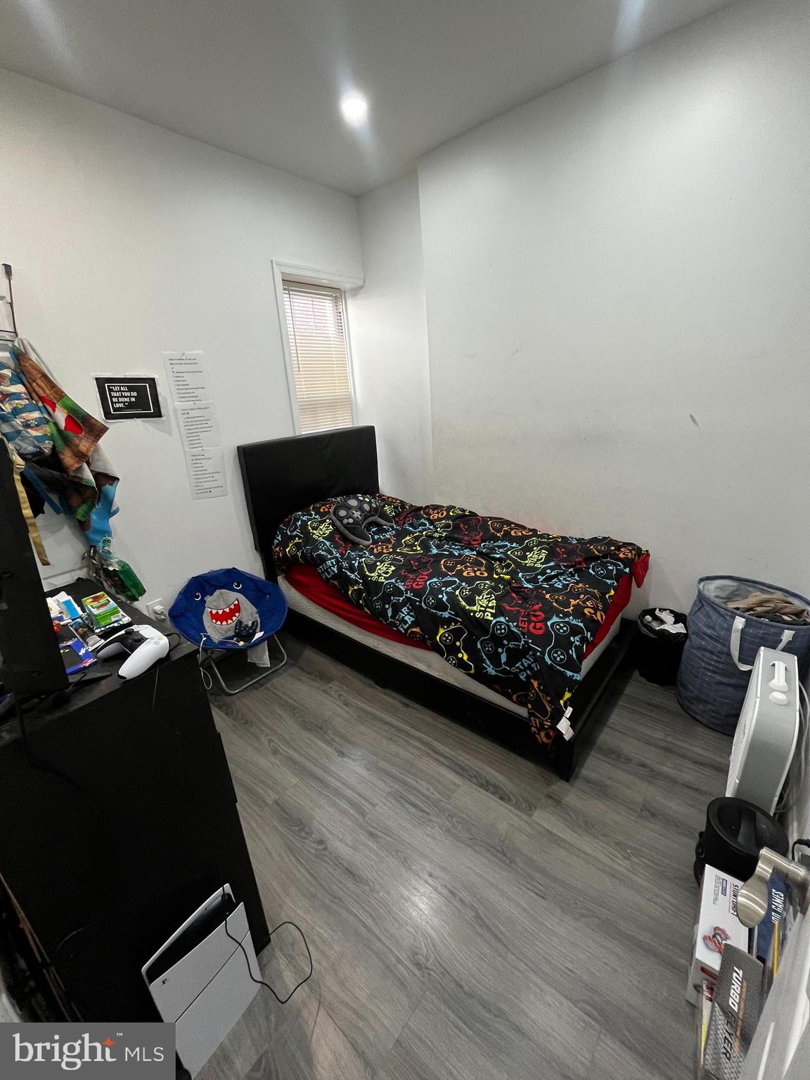 3935 North 10th Street Philadelphia, PA 19140 - Photo 10 of 12 a bed room with a bed and a chair