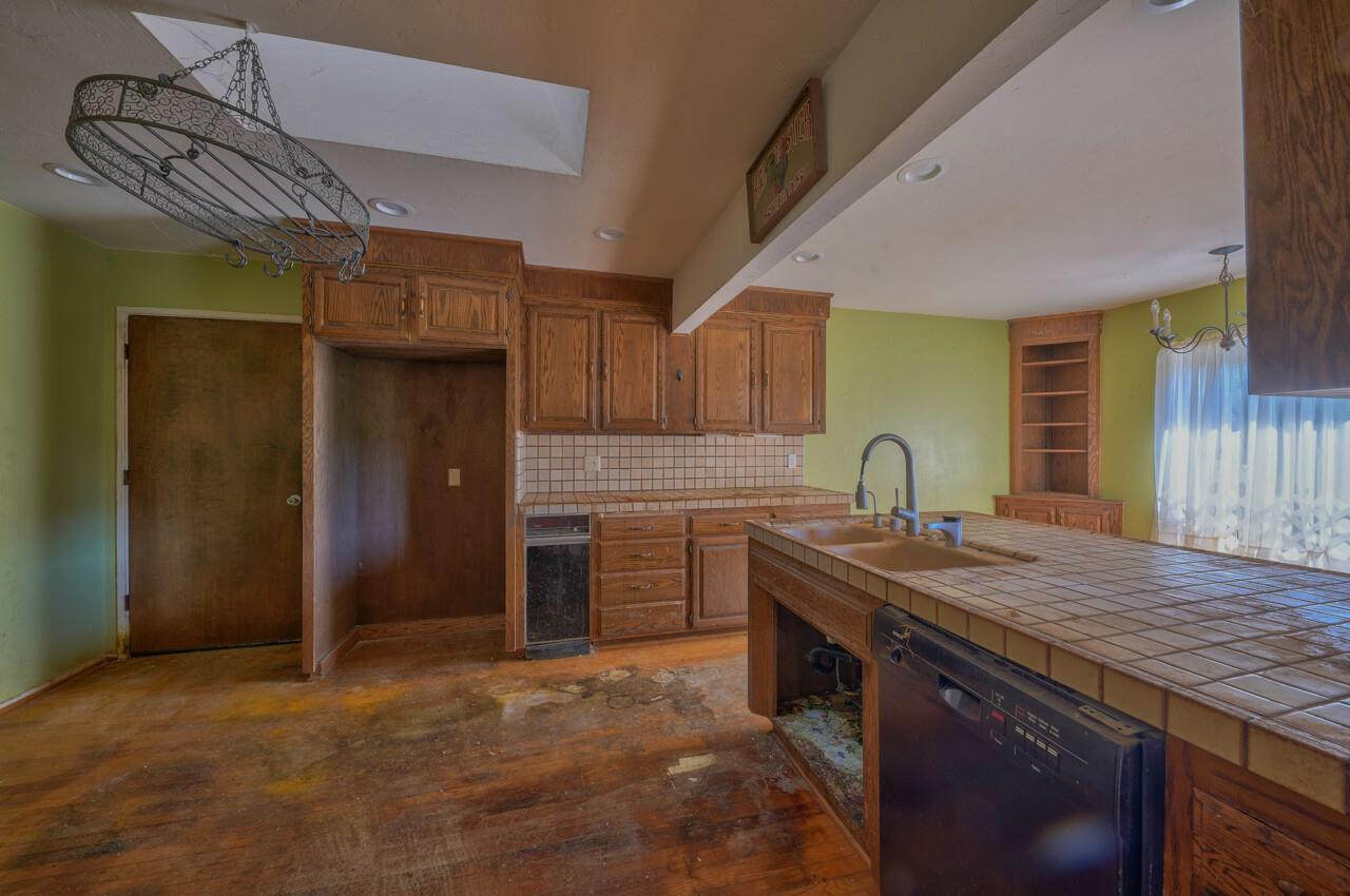 26045 Toro Road Salinas, CA 93908 - Photo 11 of 35 a kitchen with stainless steel appliances granite countertop a sink and cabinets