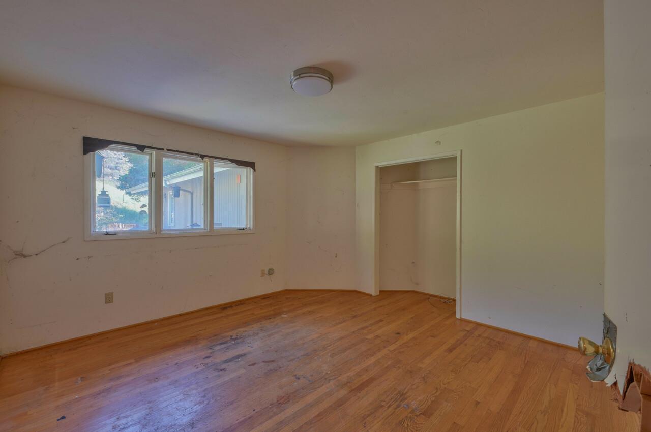 26045 Toro Road Salinas, CA 93908 - Photo 22 of 35 a view of empty room with wooden floor and fan