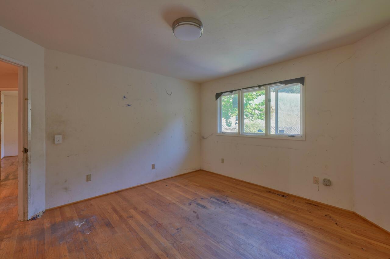26045 Toro Road Salinas, CA 93908 - Photo 23 of 35 an empty room with wooden floor and windows