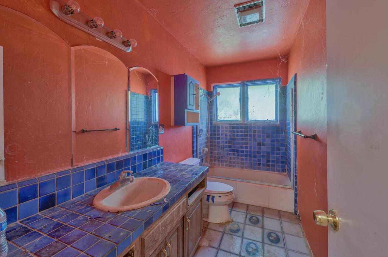 26045 Toro Road Salinas, CA 93908 - Photo 24 of 35 a bathroom with a sink a toilet and shower