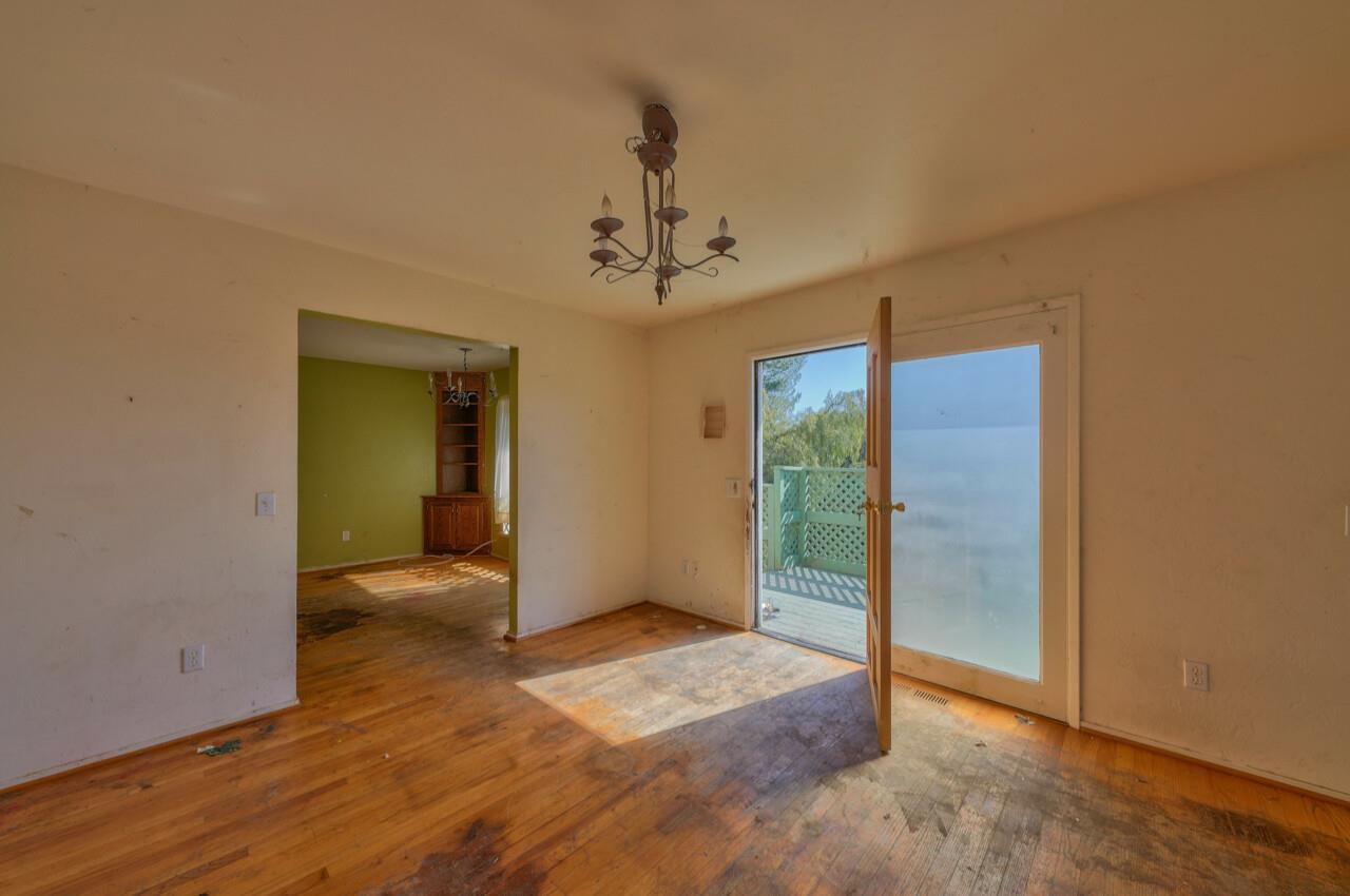 26045 Toro Road Salinas, CA 93908 - Photo 5 of 35 wooden floor in an empty room with a window