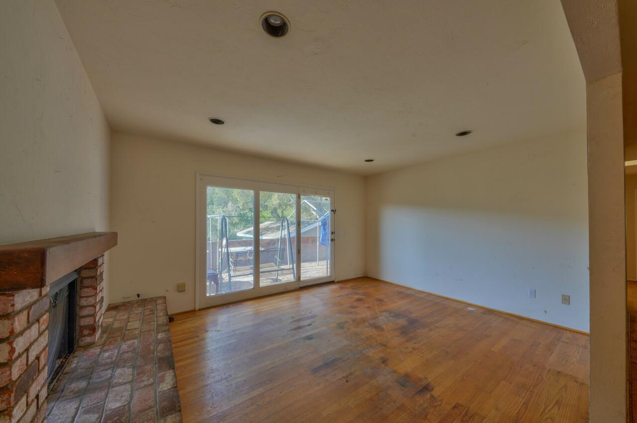 26045 Toro Road Salinas, CA 93908 - Photo 9 of 35 wooden floor in an empty room with a window