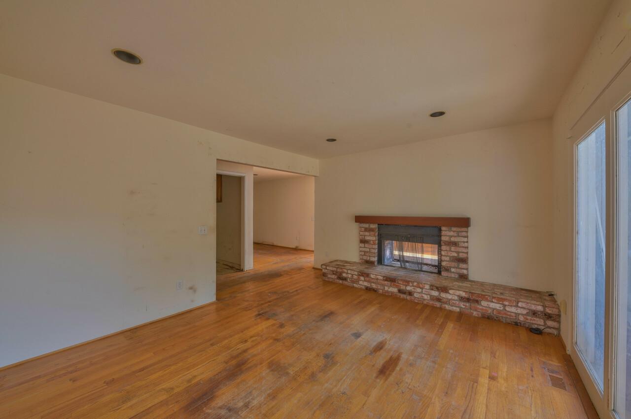 26045 Toro Road Salinas, CA 93908 - Photo 10 of 35 a view of an empty room with wooden floor and a window