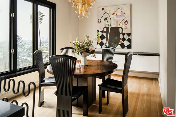 a view of a dining room with furniture and a window
