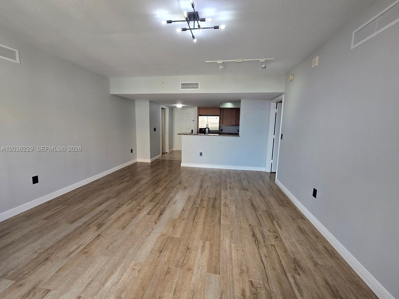 888 Douglas Road, Unit 605 Coral Gables, FL 33134 - Photo 8 of 21 a view of a room with wooden floor
