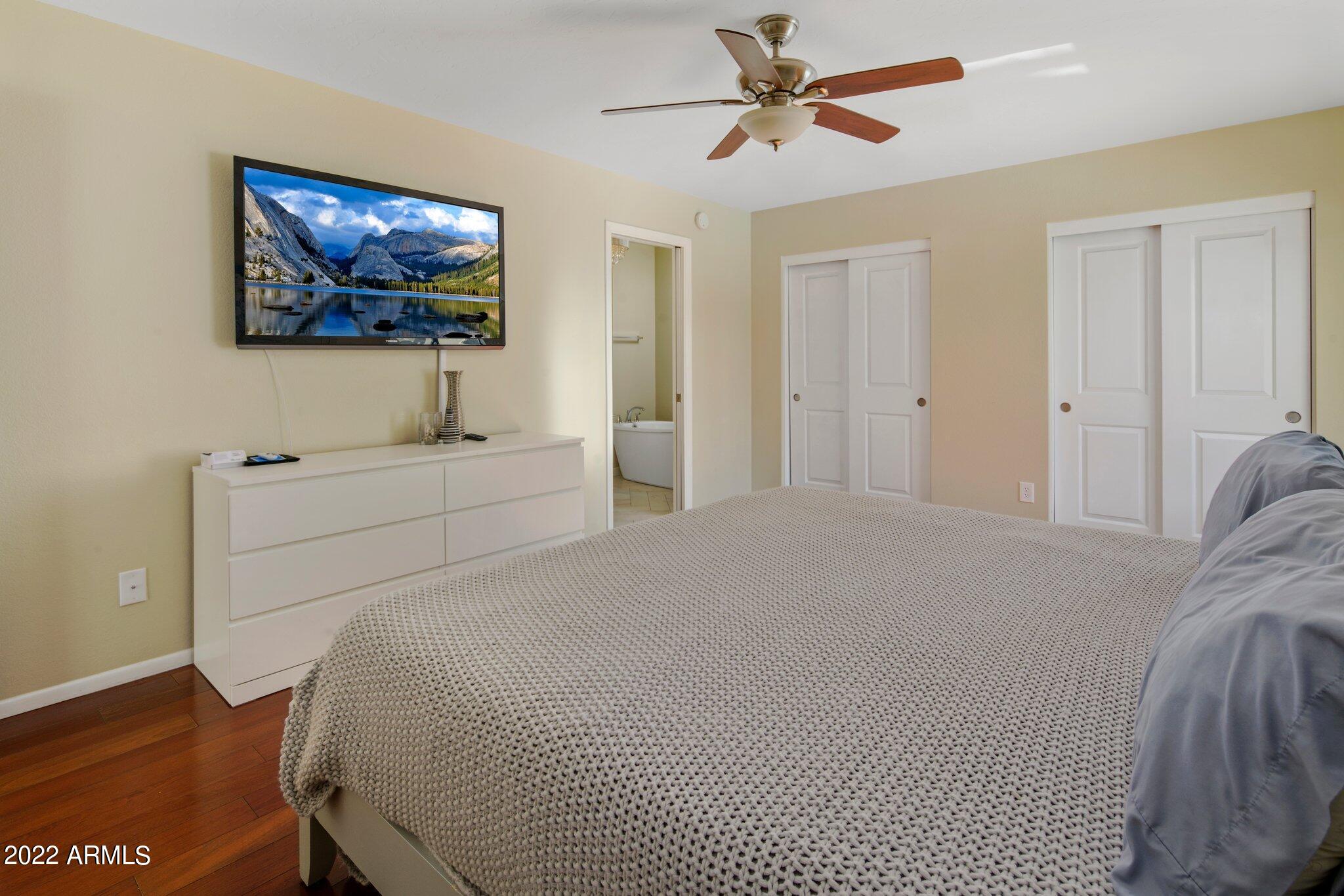 6609 East Phelps Road Scottsdale, AZ 85254 - Photo 53 of 83 a bedroom with a bed and a flat screen tv