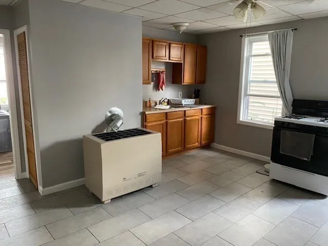 a bedroom with a bed and a dresser in it