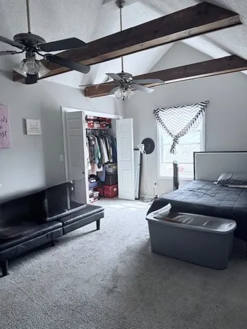 a living room with a table chairs and a dining table with wooden floor