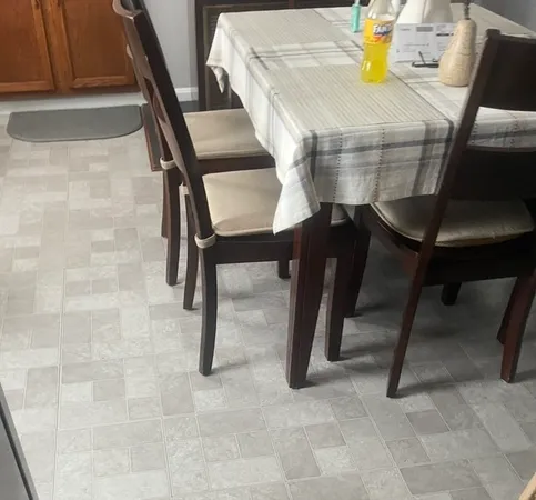 a view of a livingroom with a ceiling fan and window
