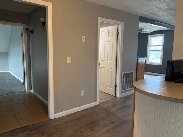a kitchen with stainless steel appliances a sink stove and cabinets