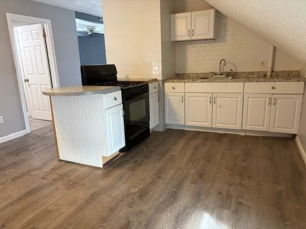 a bathroom with a toilet sink and shower