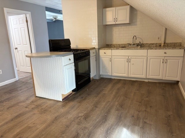 207 Rodman Street Fall River, MA 02721 - Photo 30 of 36 a kitchen with stainless steel appliances a sink stove and cabinets