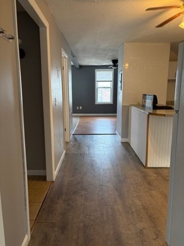 207 Rodman Street Fall River, MA 02721 - Photo 33 of 36 a view of a hallway with wooden floor and windows
