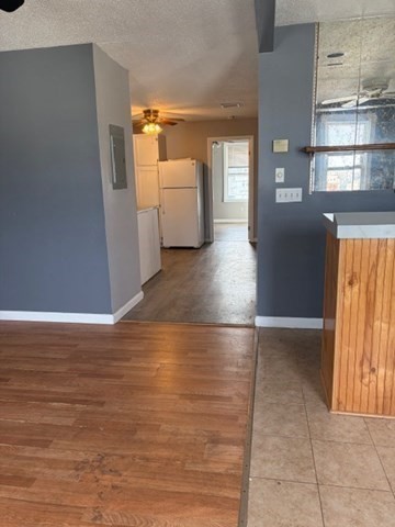 207 Rodman Street Fall River, MA 02721 - Photo 36 of 36 a view of a hallway with wooden floor and a kitchen