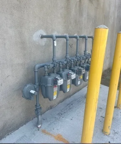 a kitchen with a table chairs and wooden floor