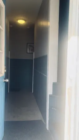 a kitchen with stainless steel appliances granite countertop wooden cabinets and a sink