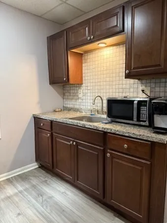 a bathroom with a toilet and a shower curtain