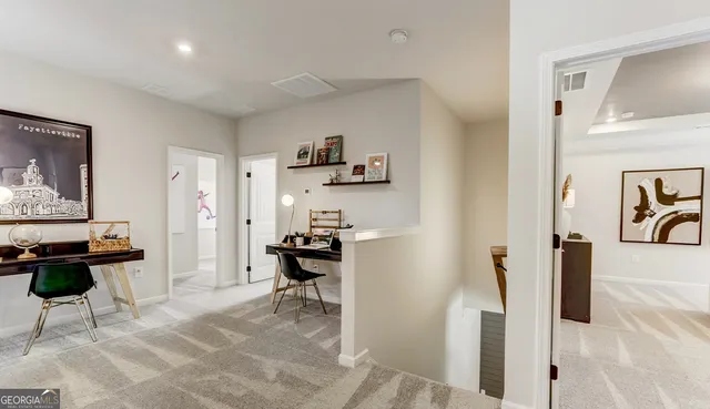 a living room with furniture a rug and a table