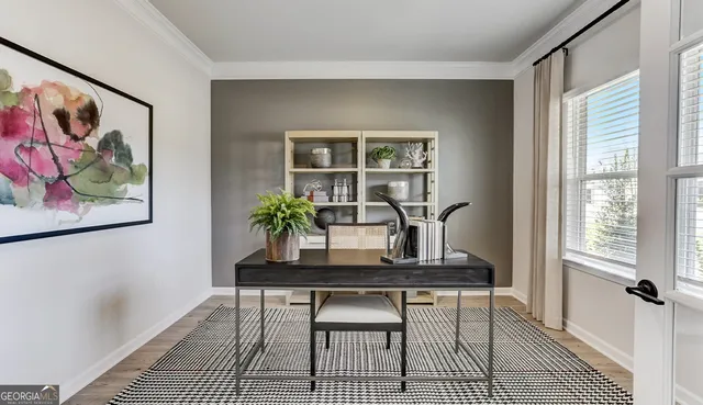 a dining room with furniture and window