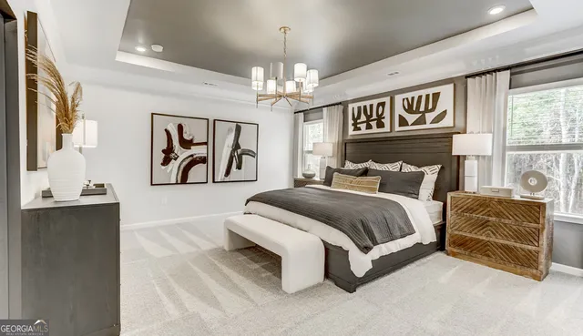 a spacious bedroom with a bed and a couch