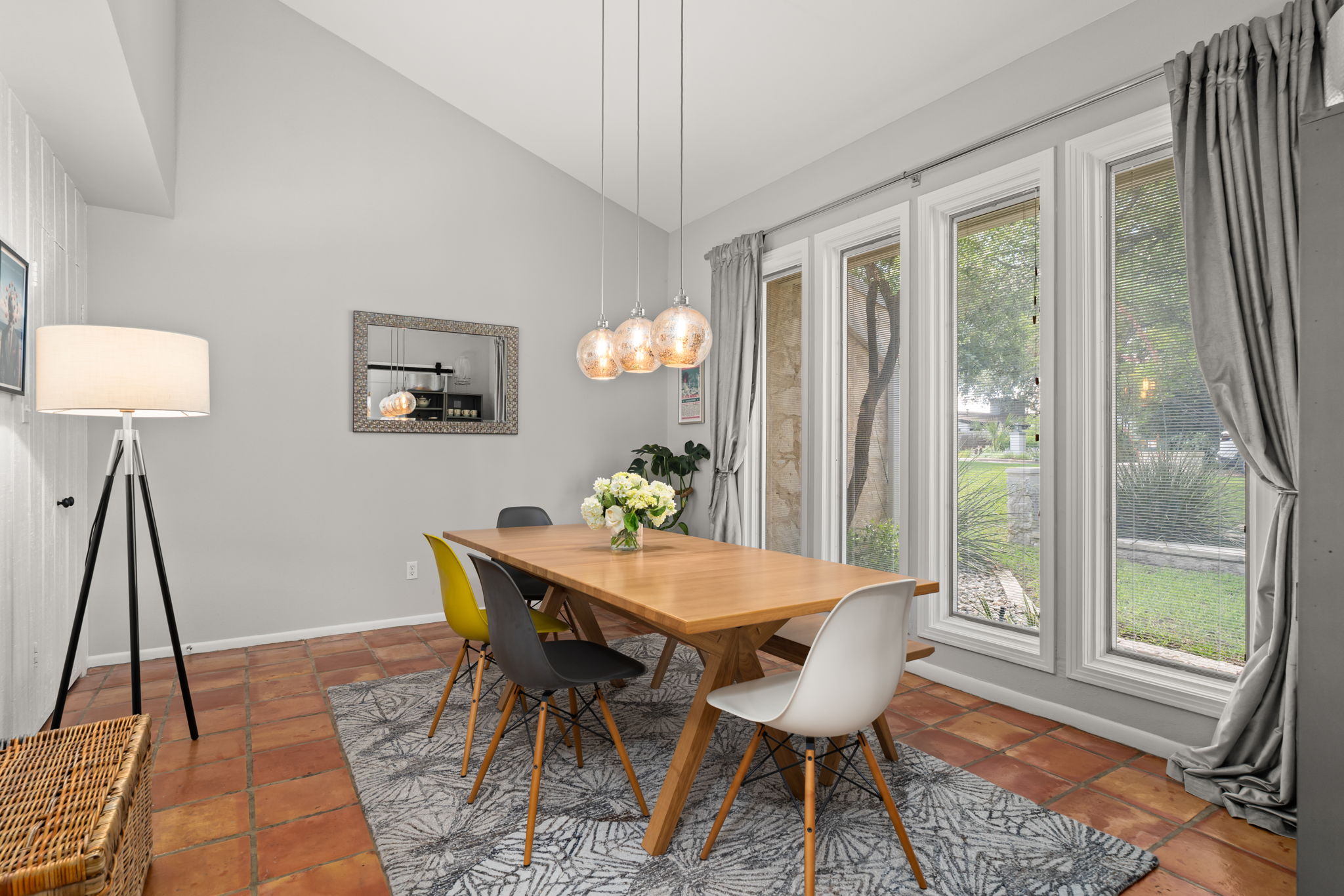 2310 Camino Alto Road Austin, TX 78746 - Photo 12 of 29 a view of a dining room with furniture wooden floor and a chandelier