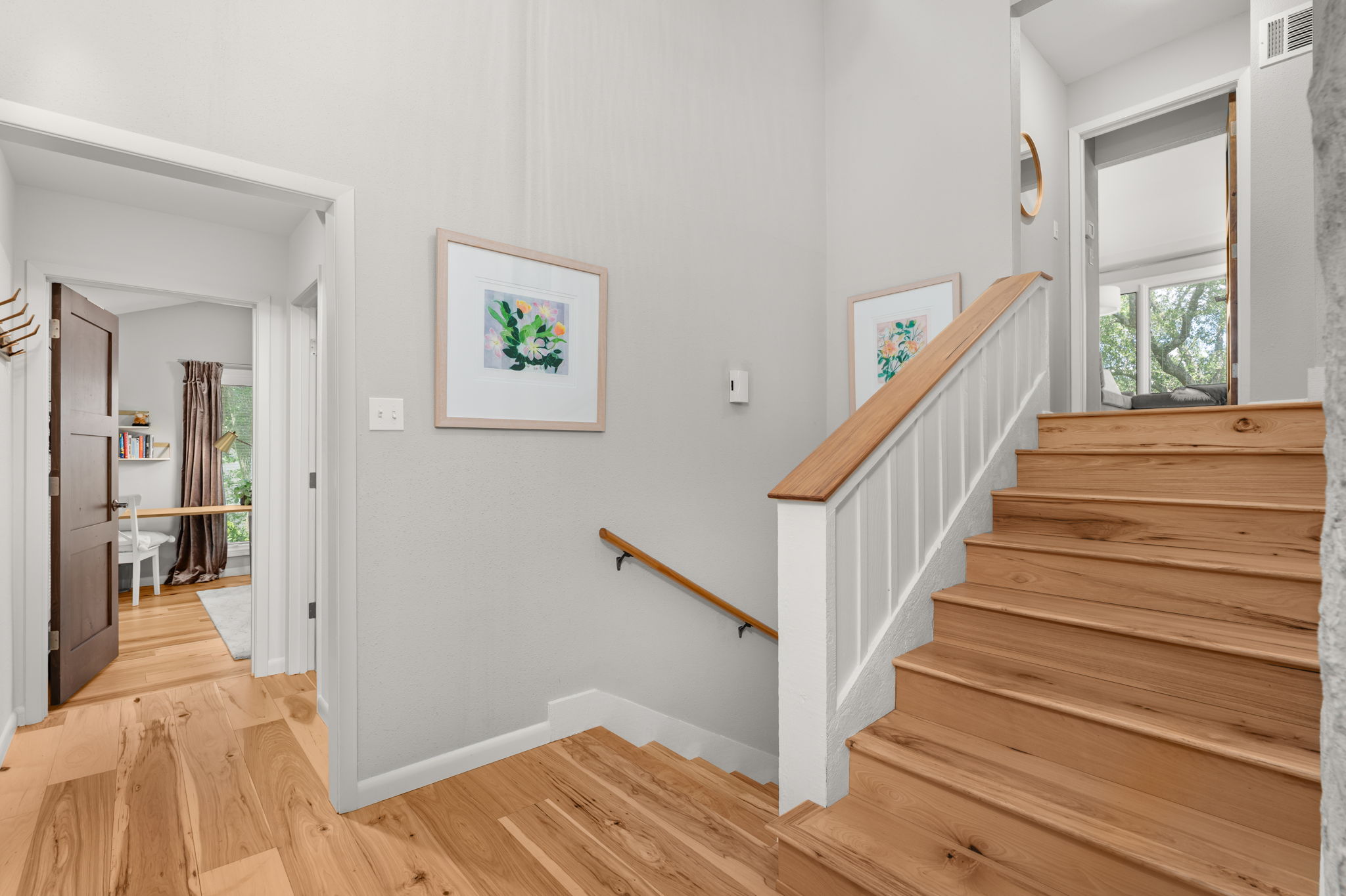 2310 Camino Alto Road Austin, TX 78746 - Photo 15 of 29 a view of entryway with wooden floor and stairs