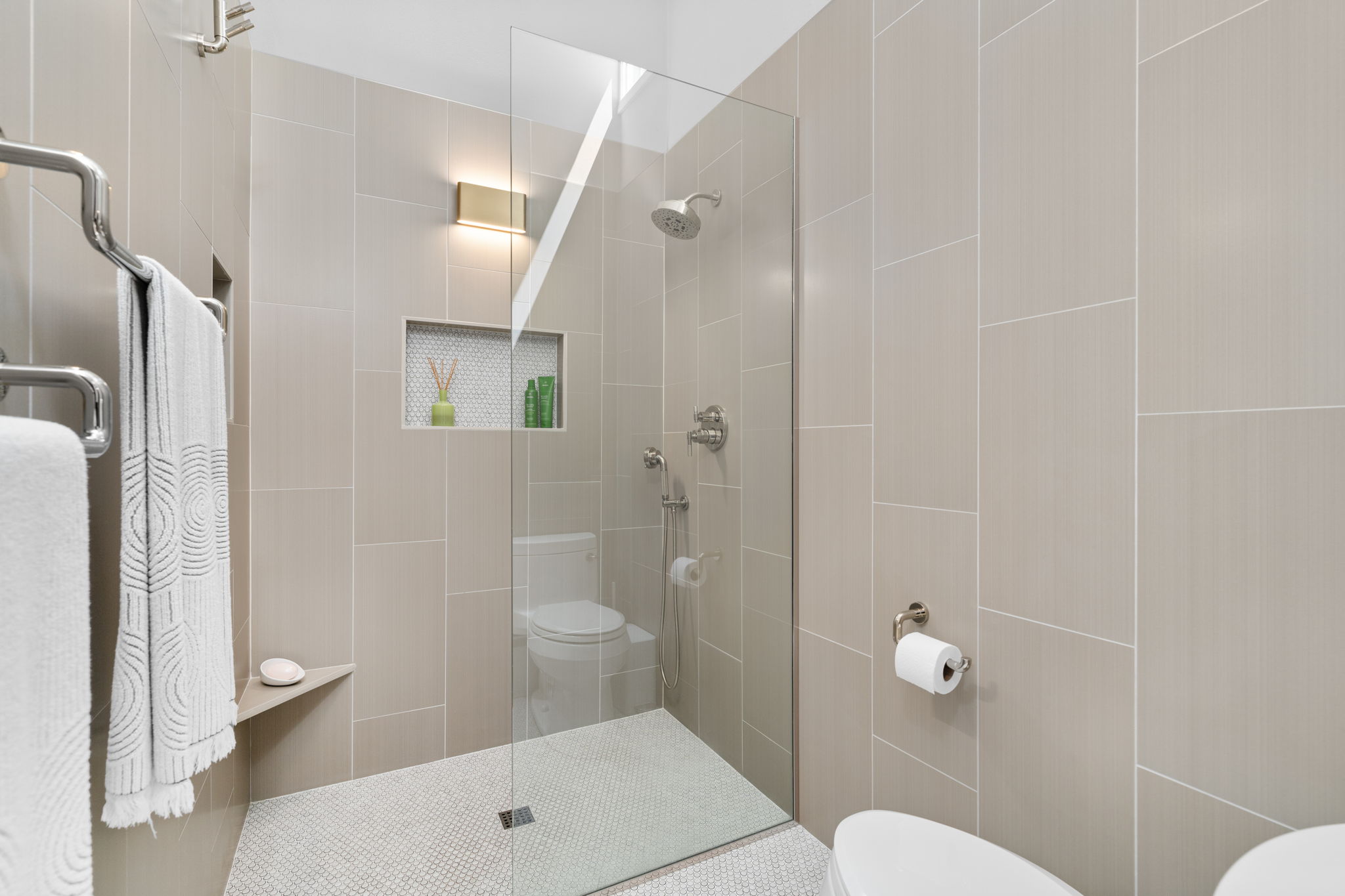 2310 Camino Alto Road Austin, TX 78746 - Photo 19 of 29 a bathroom with a toilet a sink and shower