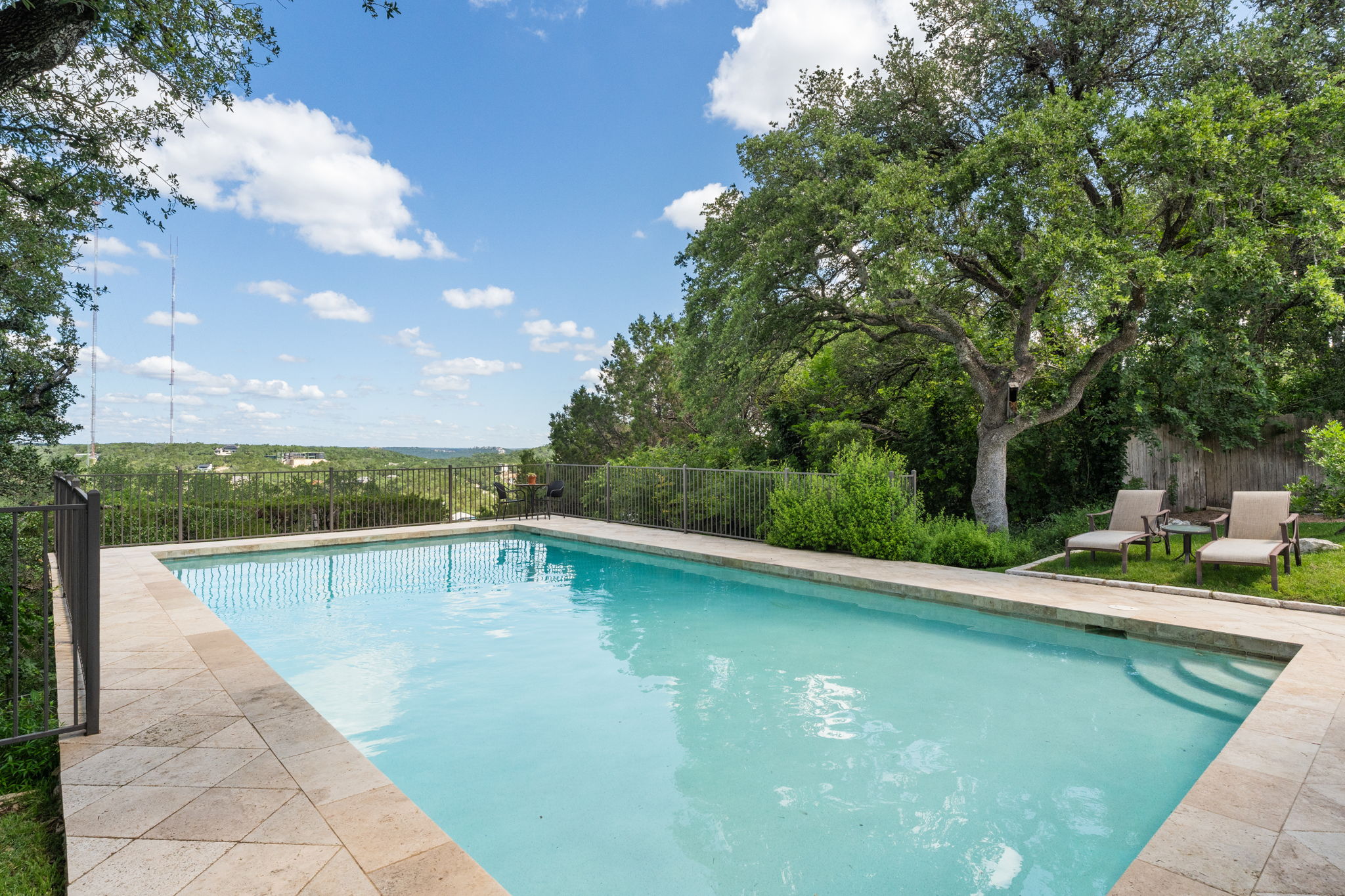 2310 Camino Alto Road Austin, TX 78746 - Photo 2 of 29 a view of a swimming pool with lounge chair