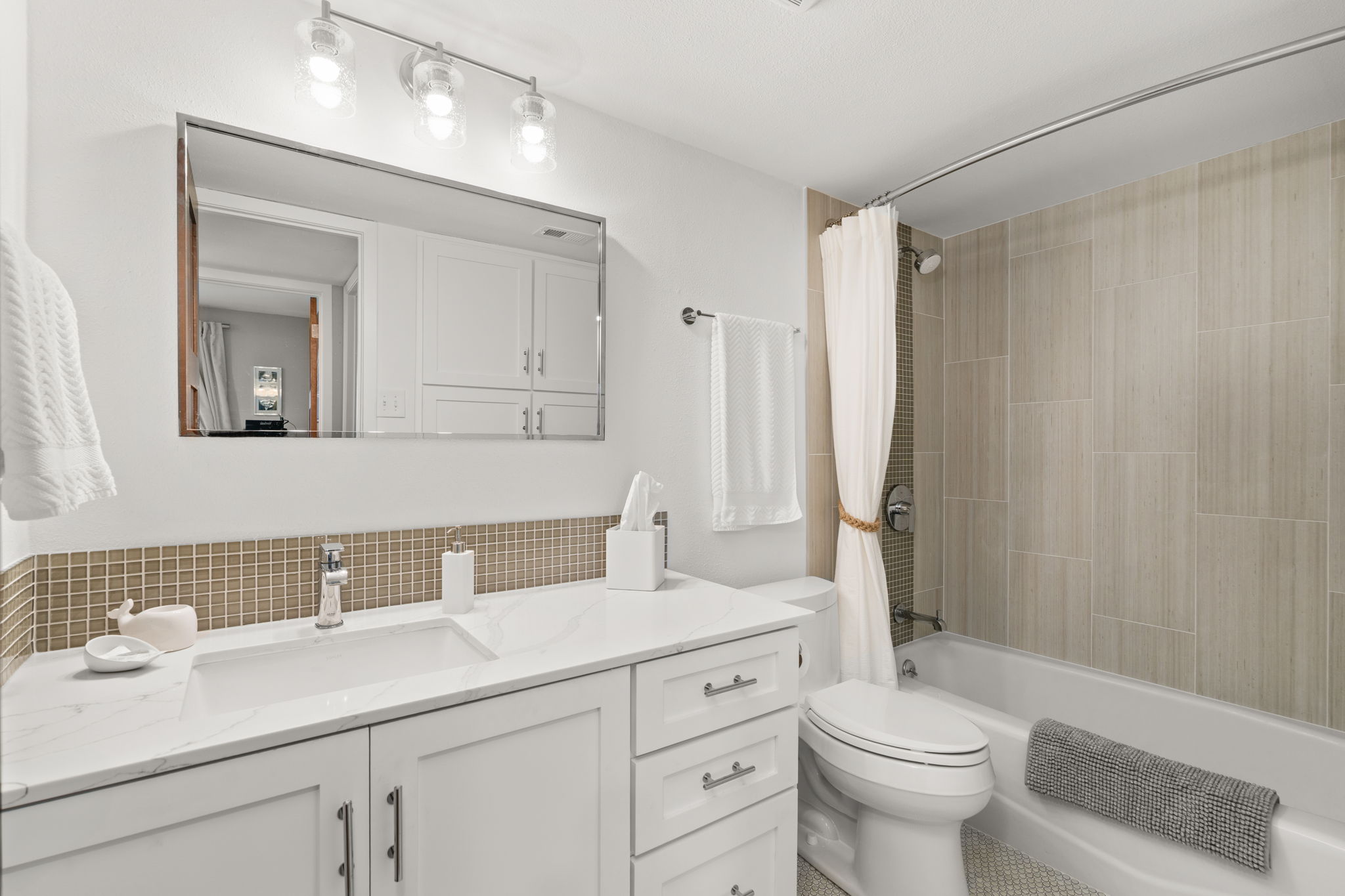 2310 Camino Alto Road Austin, TX 78746 - Photo 23 of 29 a bathroom with a sink a toilet and shower