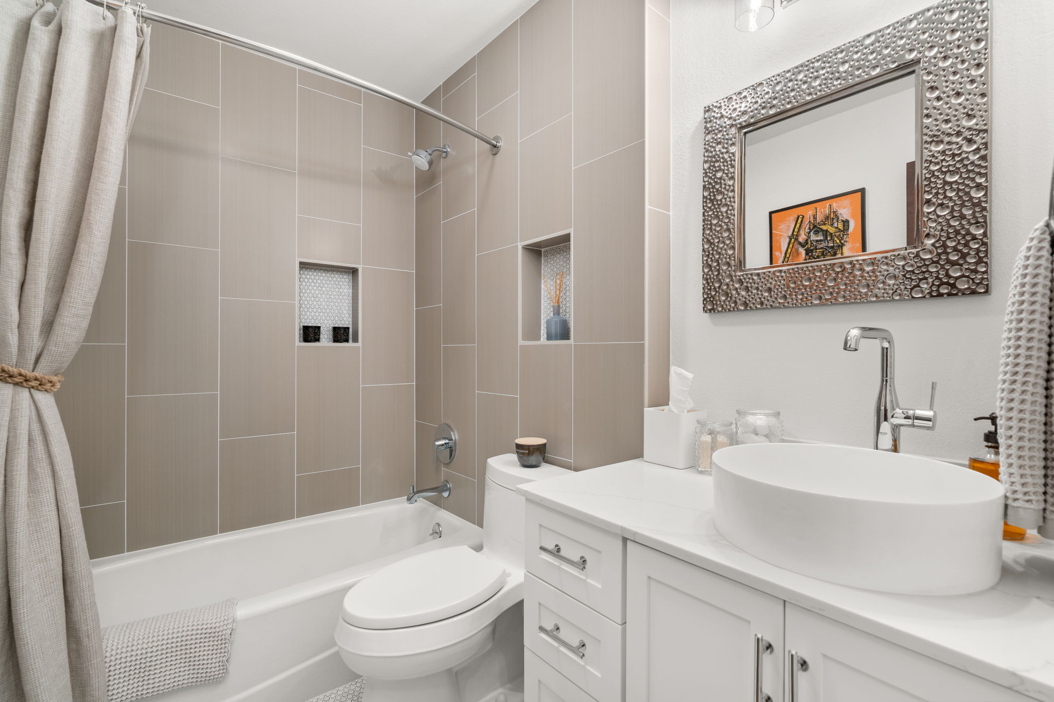 2310 Camino Alto Road Austin, TX 78746 - Photo 25 of 29 a bathroom with a sink a toilet and shower