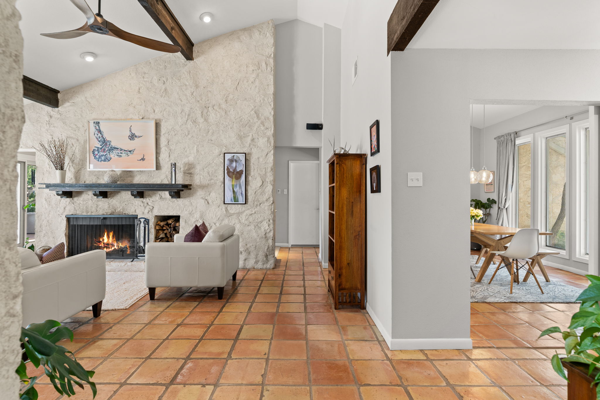 2310 Camino Alto Road Austin, TX 78746 - Photo 3 of 29 a living room with furniture and a fireplace