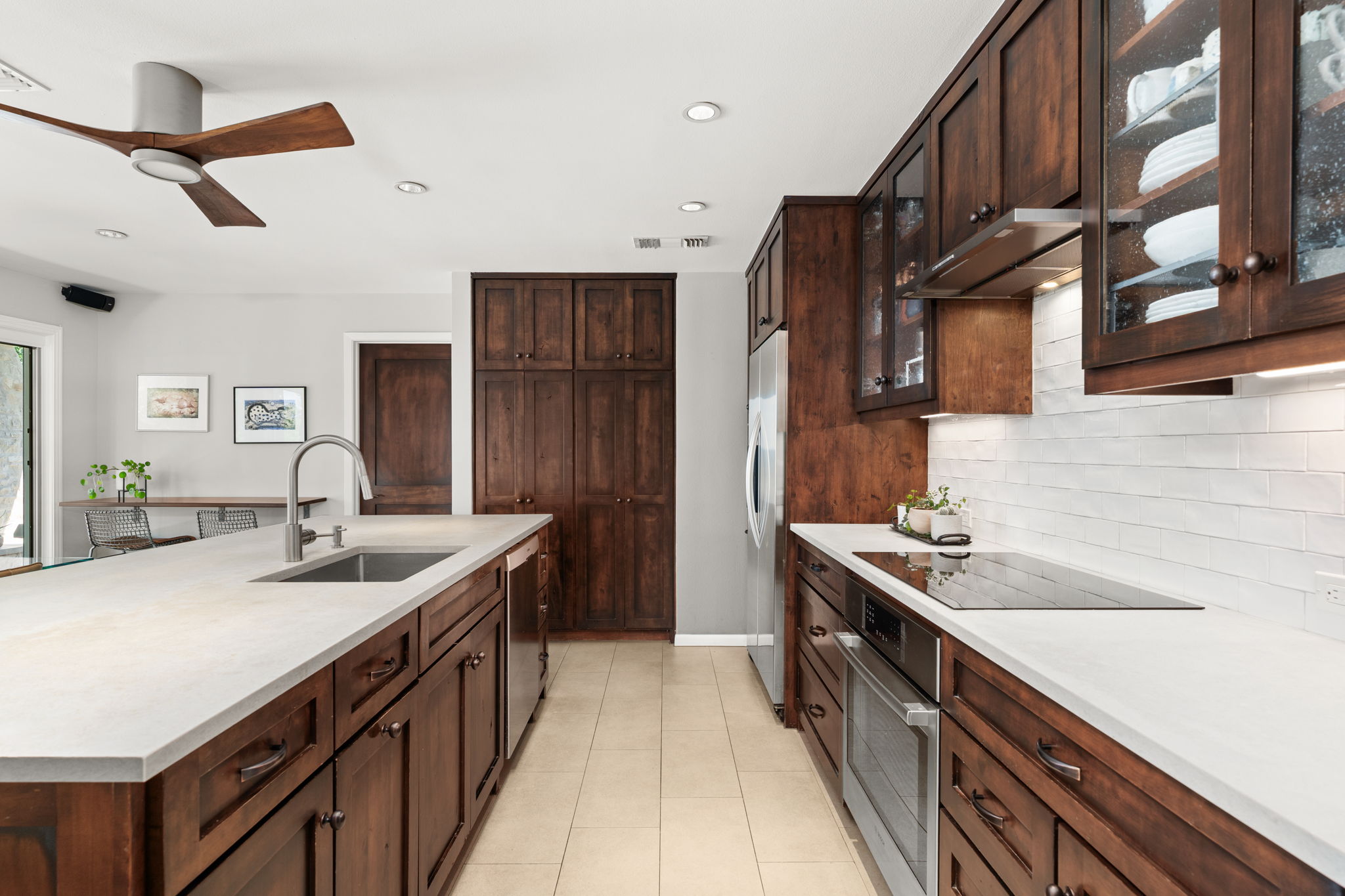 2310 Camino Alto Road Austin, TX 78746 - Photo 9 of 29 a kitchen with stainless steel appliances granite countertop a sink stove and cabinets