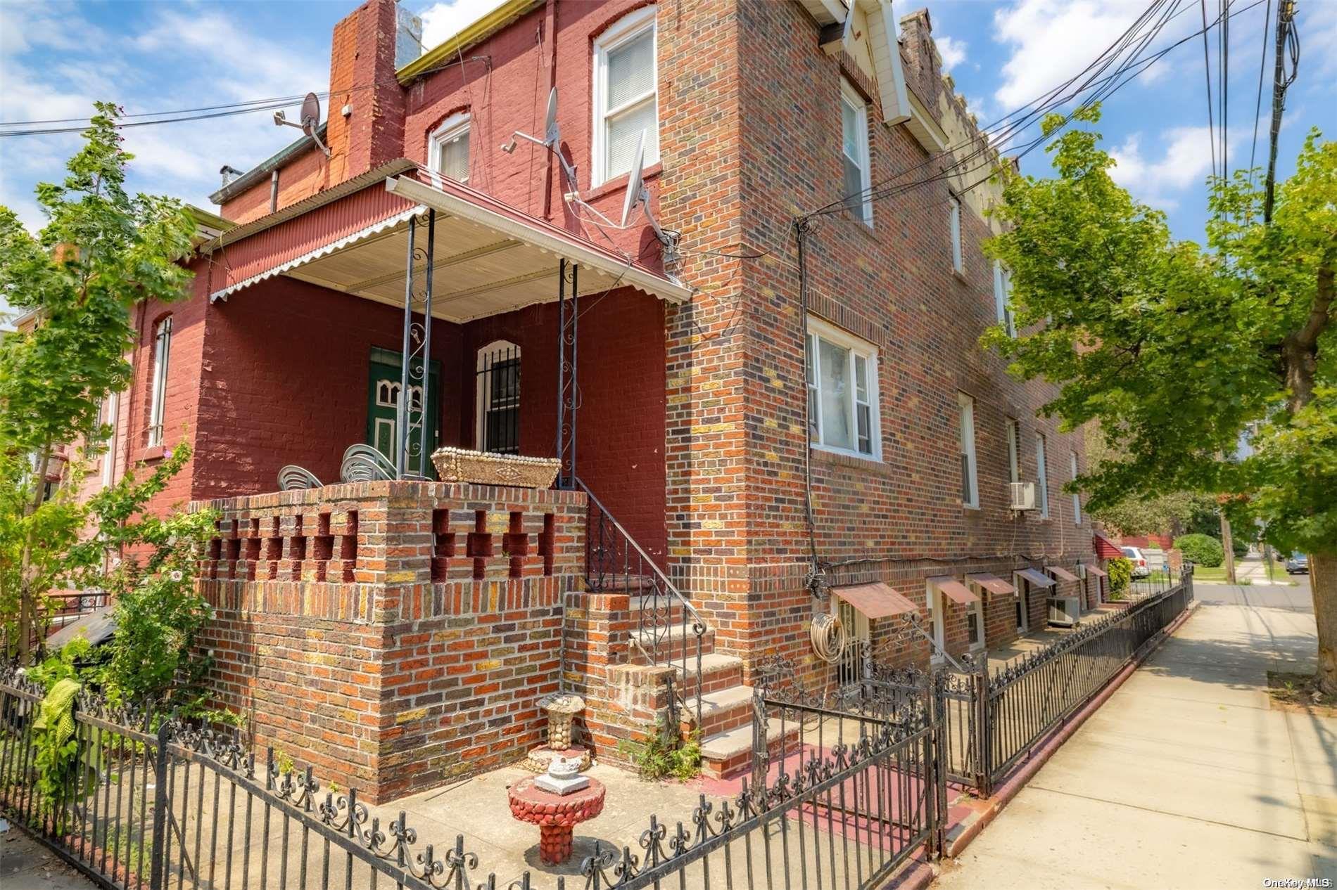 3524 Ave. M Brooklyn, NY 11234 - Photo 12 of 12 a view of a house with a small yard and furniture