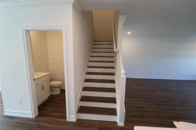 a kitchen with a cabinets and wooden floor