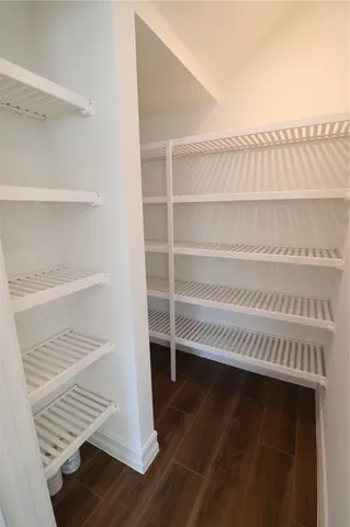 a view of a hallway with a wooden floor