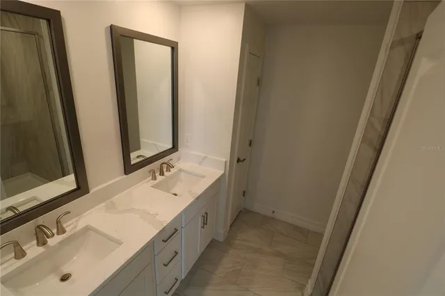 a view of a street with a building in the background