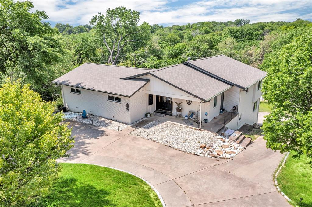 110 Vanshire Road West Lakeside, TX 76108 - Photo 1 of 34 a aerial view of a house with a yard plants and large tree