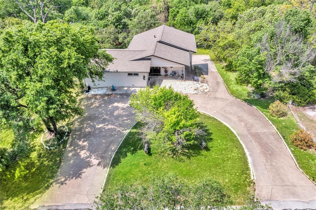 110 Vanshire Road West Lakeside, TX 76108 - Photo 2 of 34 a aerial view of a house with a yard and shrubs