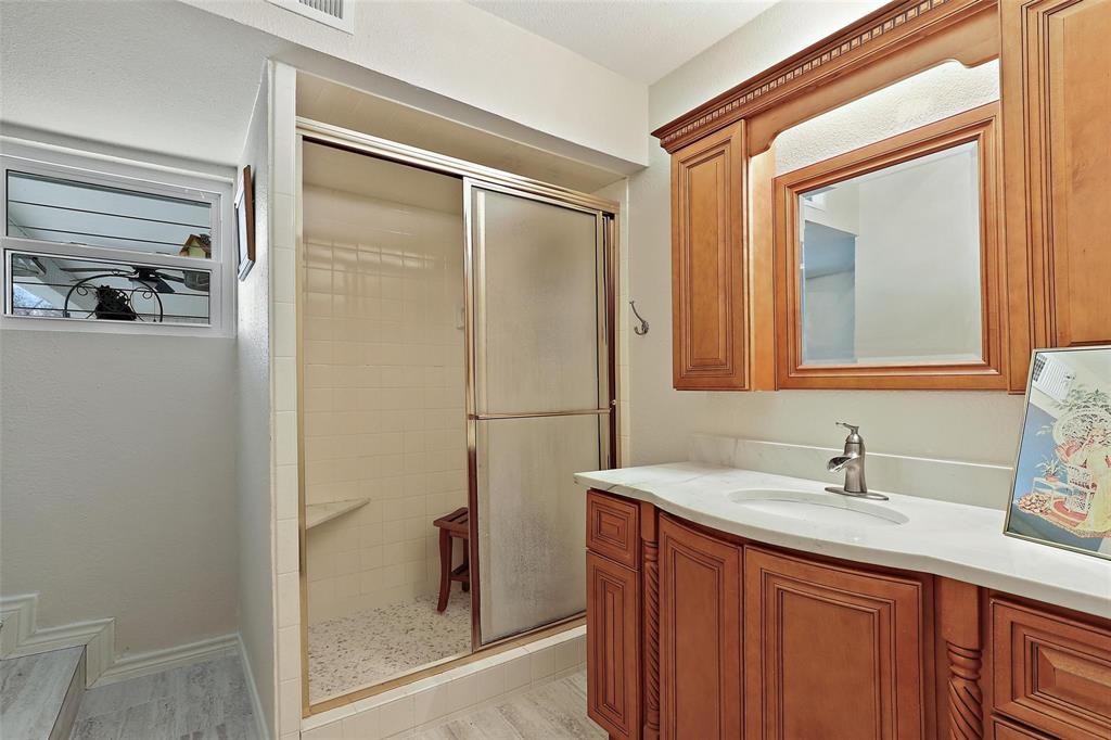 110 Vanshire Road West Lakeside, TX 76108 - Photo 23 of 34 a bathroom with a sink a mirror and a shower