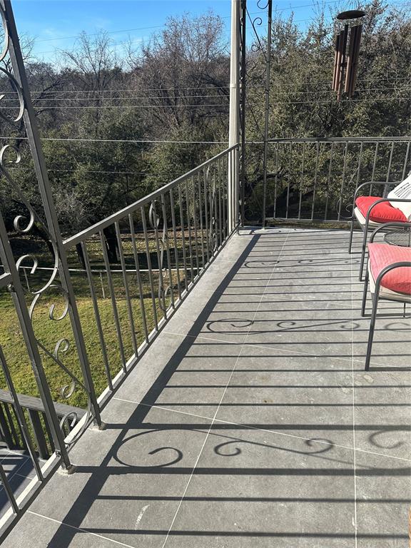 110 Vanshire Road West Lakeside, TX 76108 - Photo 27 of 34 a view of balcony with wooden floor and fence