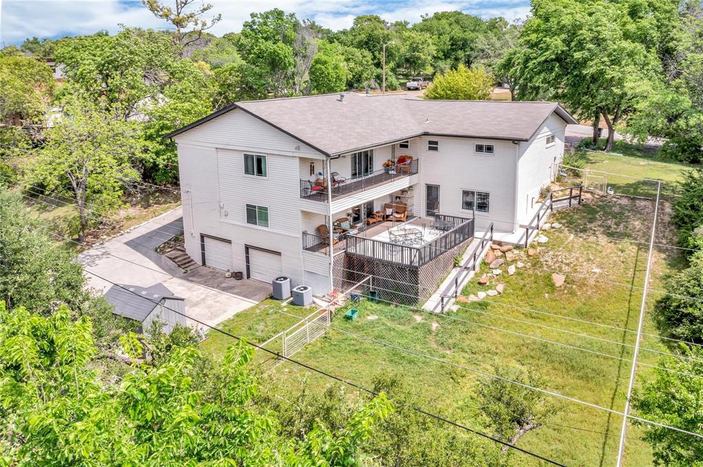 110 Vanshire Road West Lakeside, TX 76108 - Photo 32 of 34 an aerial view of a house with swimming pool next to a big yard